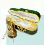 Souvenir "Violoncello". Gold, tiger eye, brilliants, malachite, white satin.